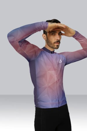 Male cyclist wearing Aidan Global’s Best Custom Cycling Jersey – Race Fit, full-sleeve design with gradient purple and pink geometric pattern.