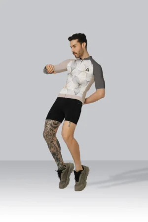 Cyclist wearing a custom race fit cycling jersey with YKK zipper, silicone gel hem, and reflector for performance and safety.